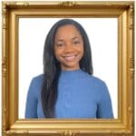 Smiling woman in a gold frame portrait.