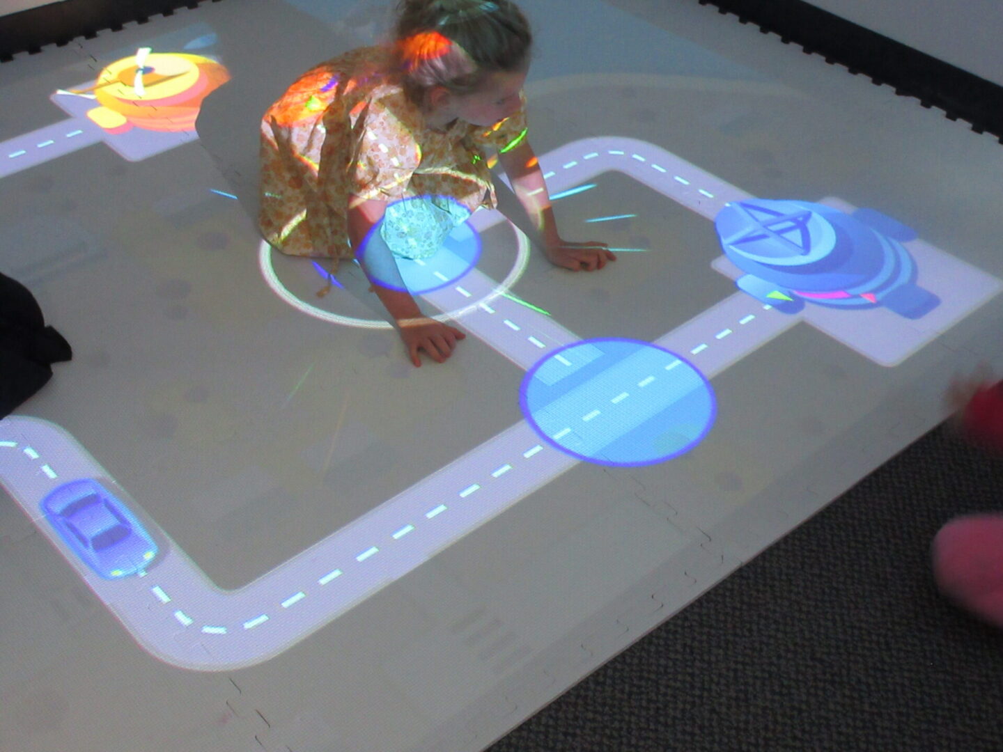 Interactive road projection with child playing