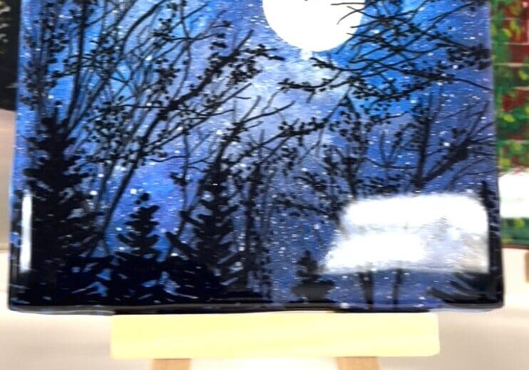 Moonlit forest painting on small easel.
