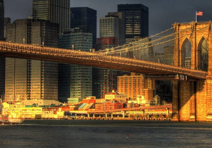 Brooklyn Bridge and city skyline at sunset.